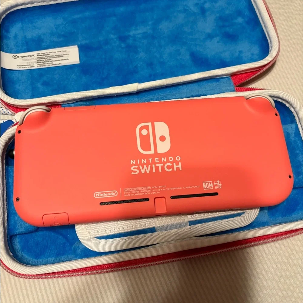 Nintendo Switch Lite Coral with Kirby Case